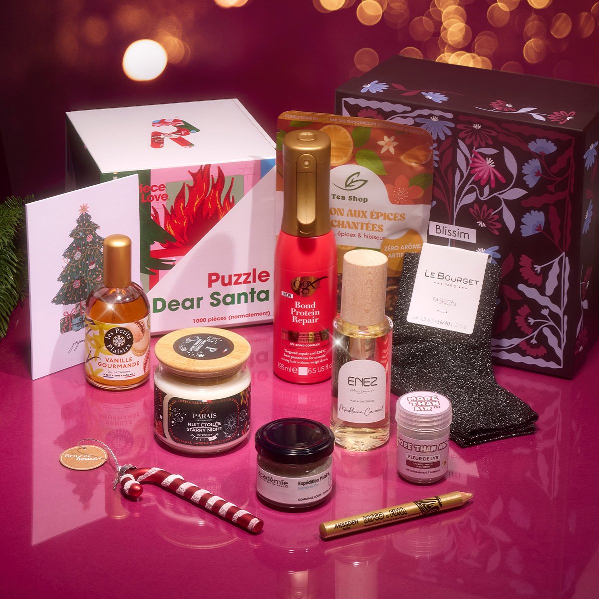 Coffret Blissim Christmas Mood avec puzzle, soins, bougie et accessoires sur fond rose