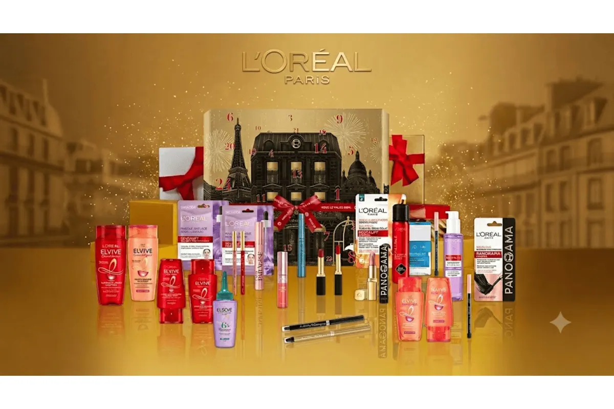Calendrier de l'Avent L'Oréal Paris 24 produits maquillage, soins capillaires, soins visage : rouges à lèvres, mascaras, shampoings, masques, sur fond doré festif