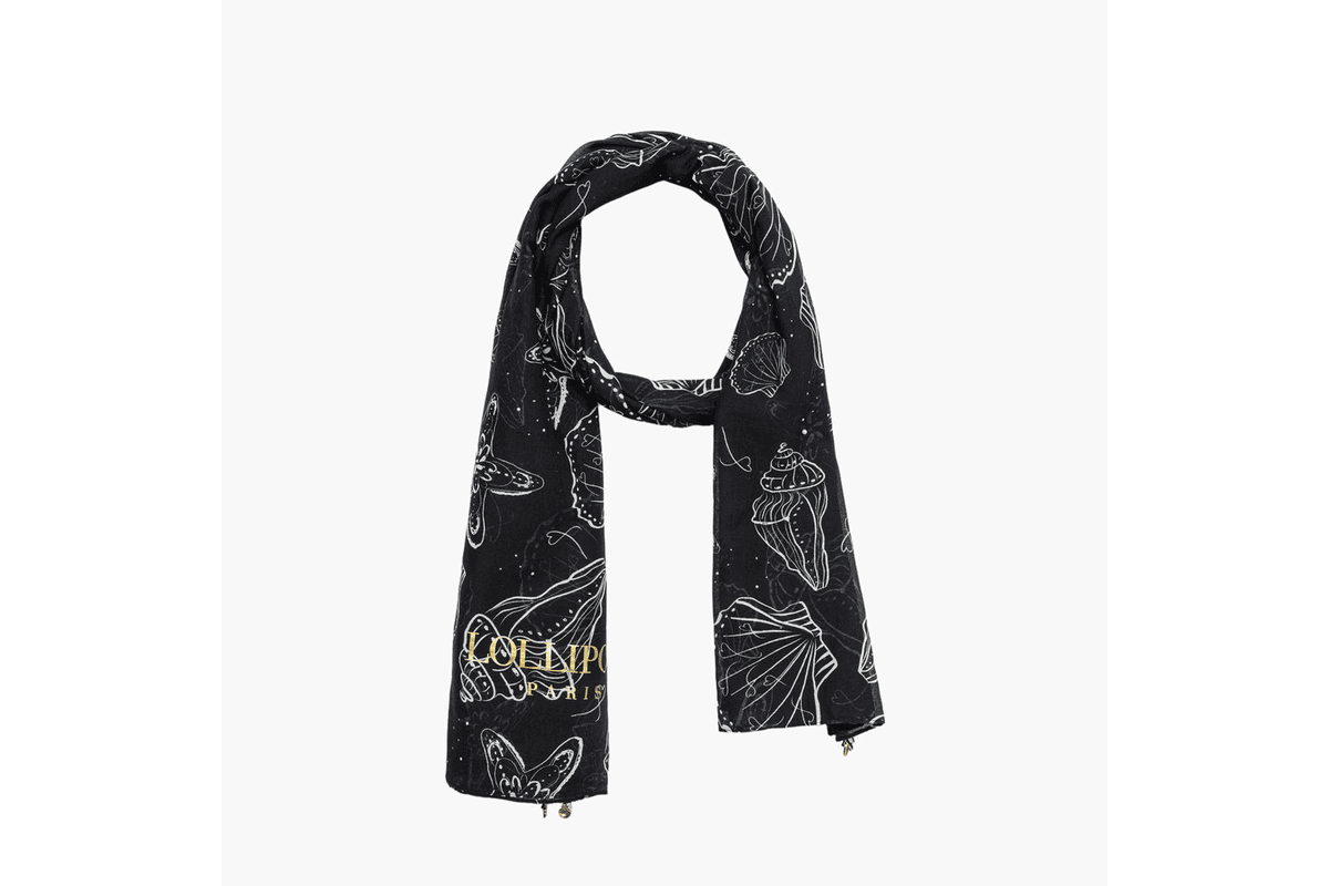 Foulard Sava rectangulaire noir Lollipops posé à plat sur fond clair