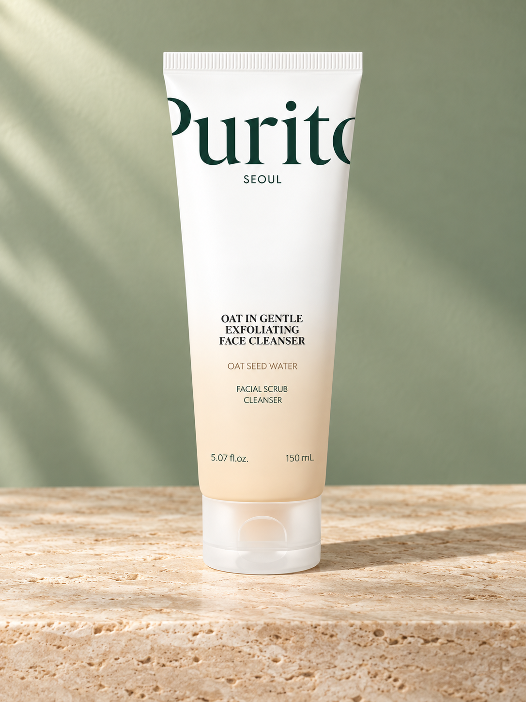Tube Purito Oat In Gentle Exfoliating Face Cleanser sur travertin et fond sauge